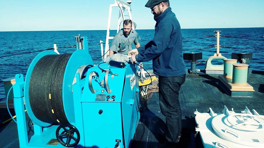 The winch used to raise and lower the towfish.