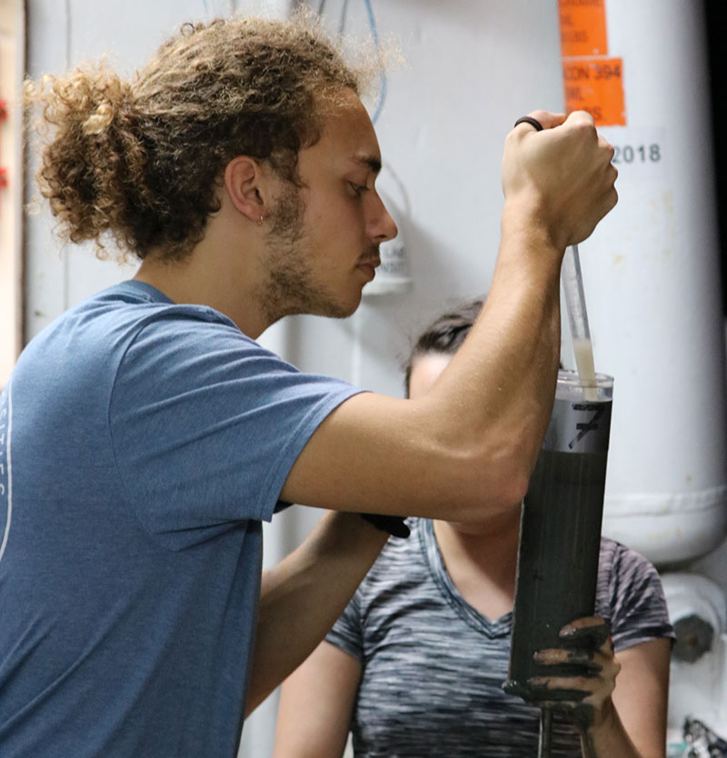 Herbert Leavitt shown processing core samples on the RV Pelican while volunteering on another cruise project this past spring. Image courtesy of Dr. Craig McCLain and LUMCON.