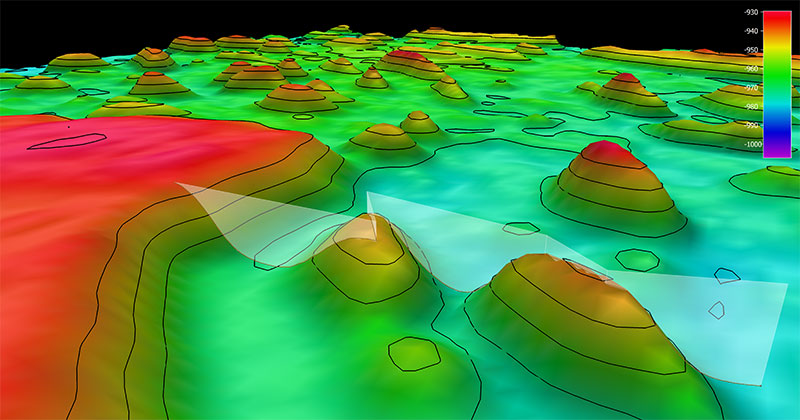 The remotely operated vehicle track for Dive 12 of the 2019 Southeastern U.S. Deep-sea Exploration, shown as an orange line with a white curtain. This mapping data was collected during the 2019 NOAA Ship Okeanos Explorer shakedown expedition. Legend shows water depth in meters.